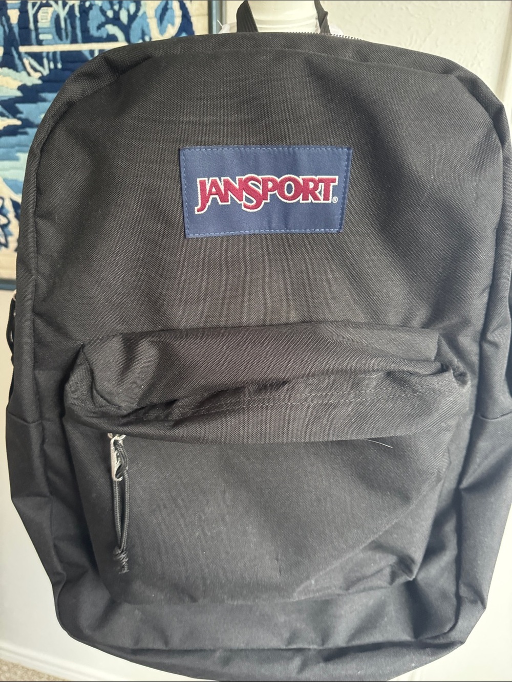 Jansport Black Backpack with Navy Logo Patch